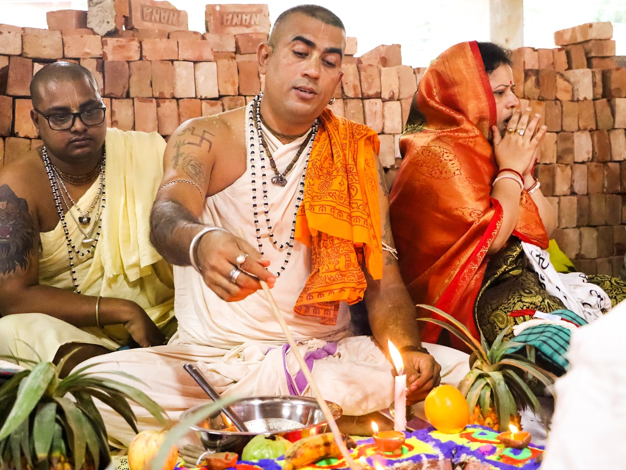 services-04 Priests performing a Hindu ritual in Dhaka, showcasing vibrant cultural traditions.