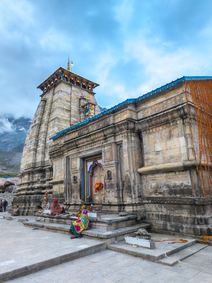 why-choose-us A breathtaking view of a historic Hindu temple set against a scenic mountain backdrop, capturing cultural and architectural heritage.