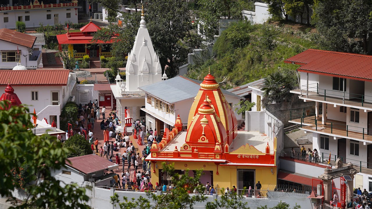 services-02 A lively aerial view of Kainchi Dham temple complex capturing its vibrant architecture and bustling activity.